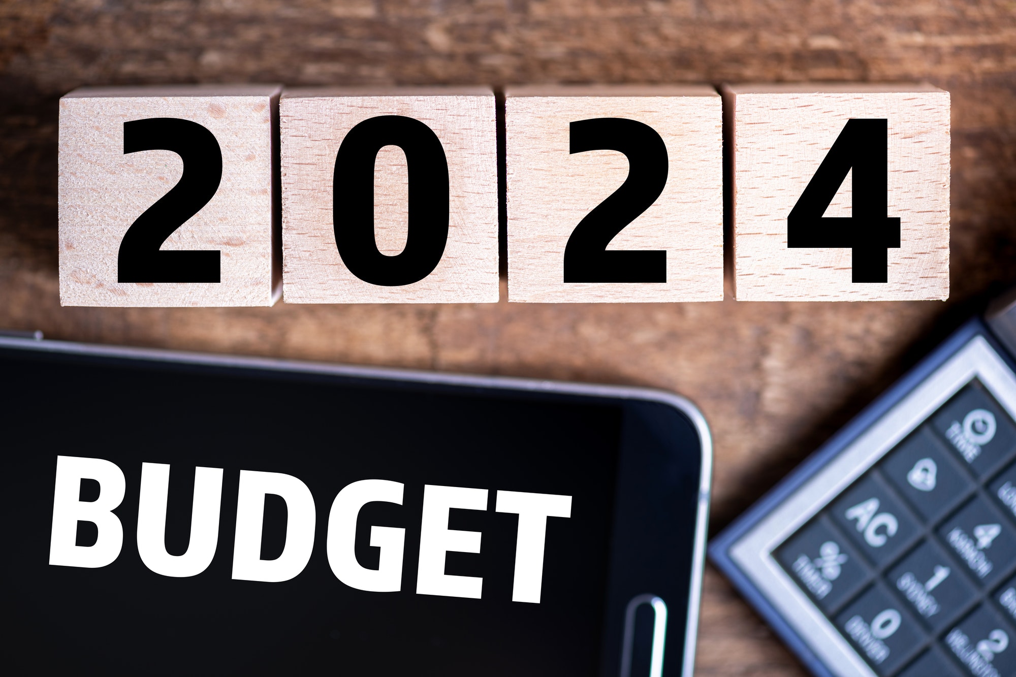 Budget 2024 new year on wooden blocks and office business concept background. 2024 Budget planning